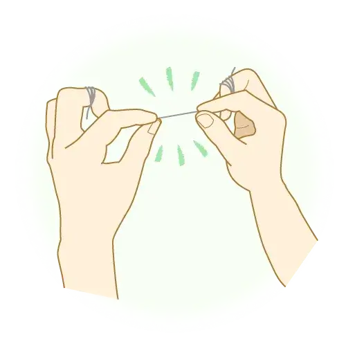 指に巻き付けたフロス②